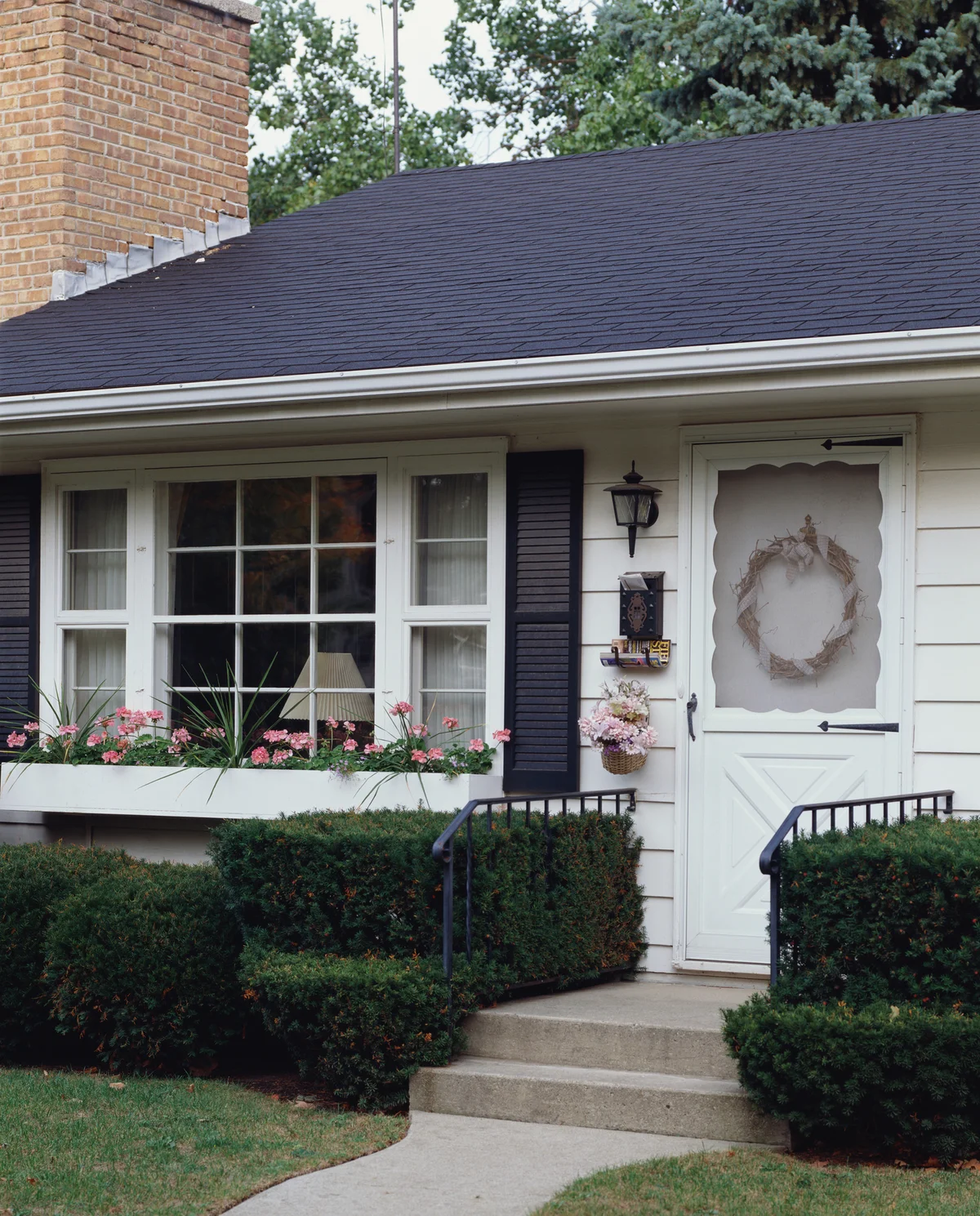House front porch decorated with pink flowers