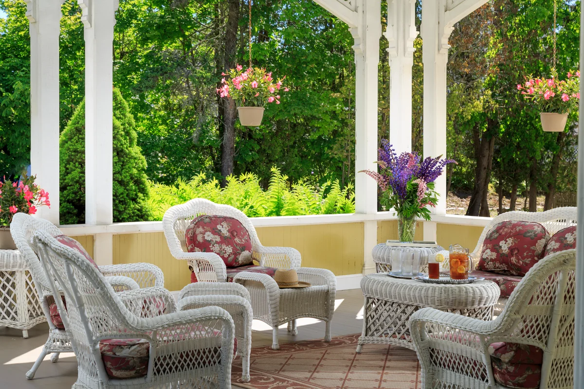 Front porch with hanging baskets and flowers