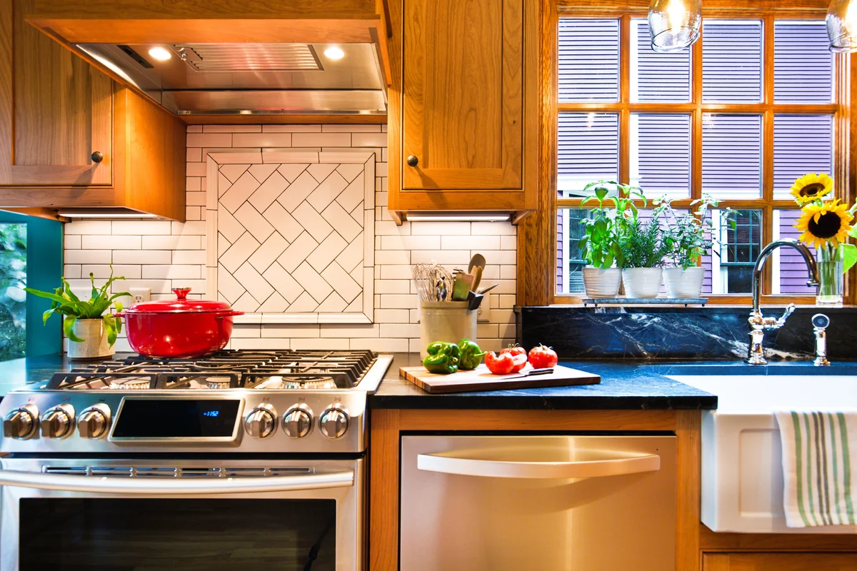 kitchen with open window and vent hood