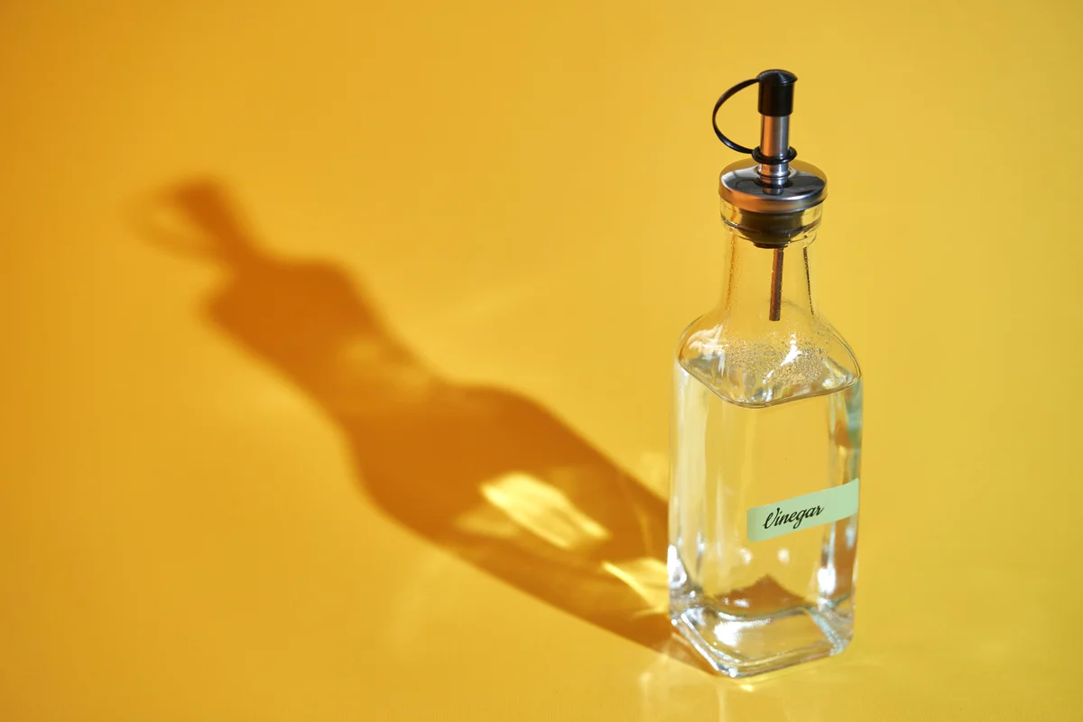 white vinegar yellow background