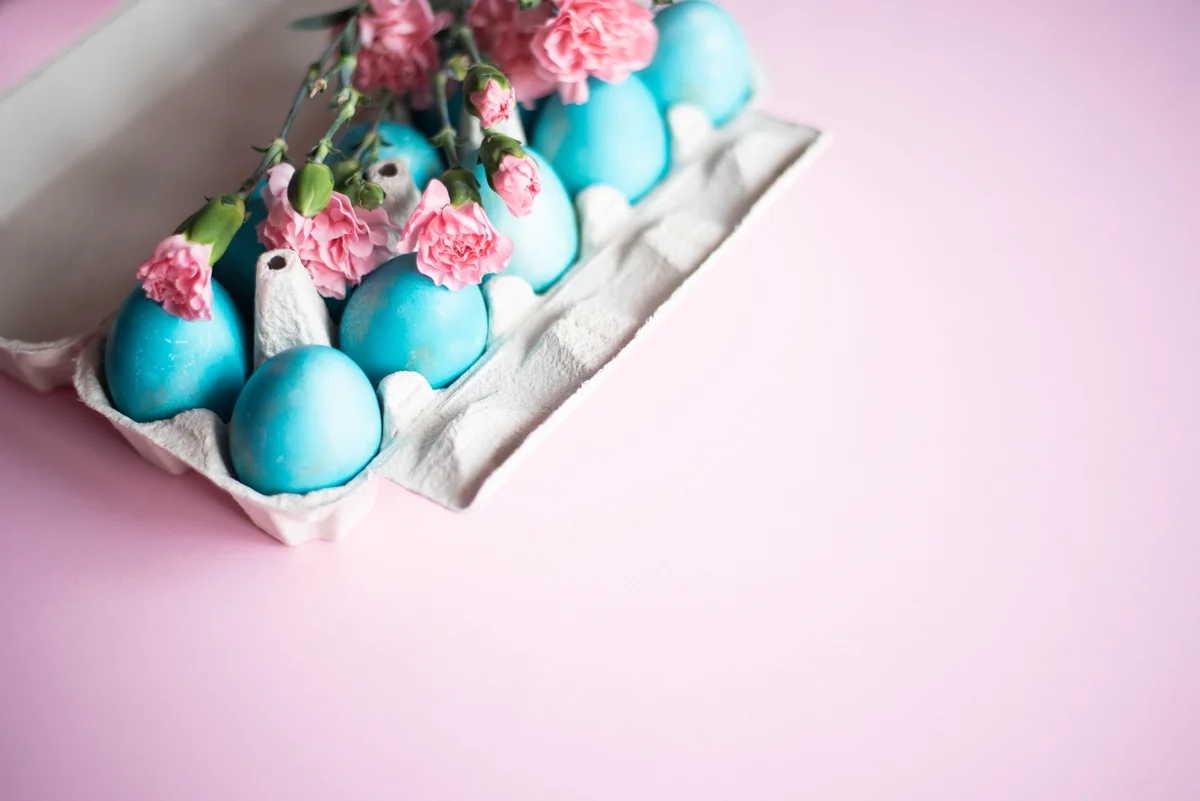 pink carnations and blue Easter eggs