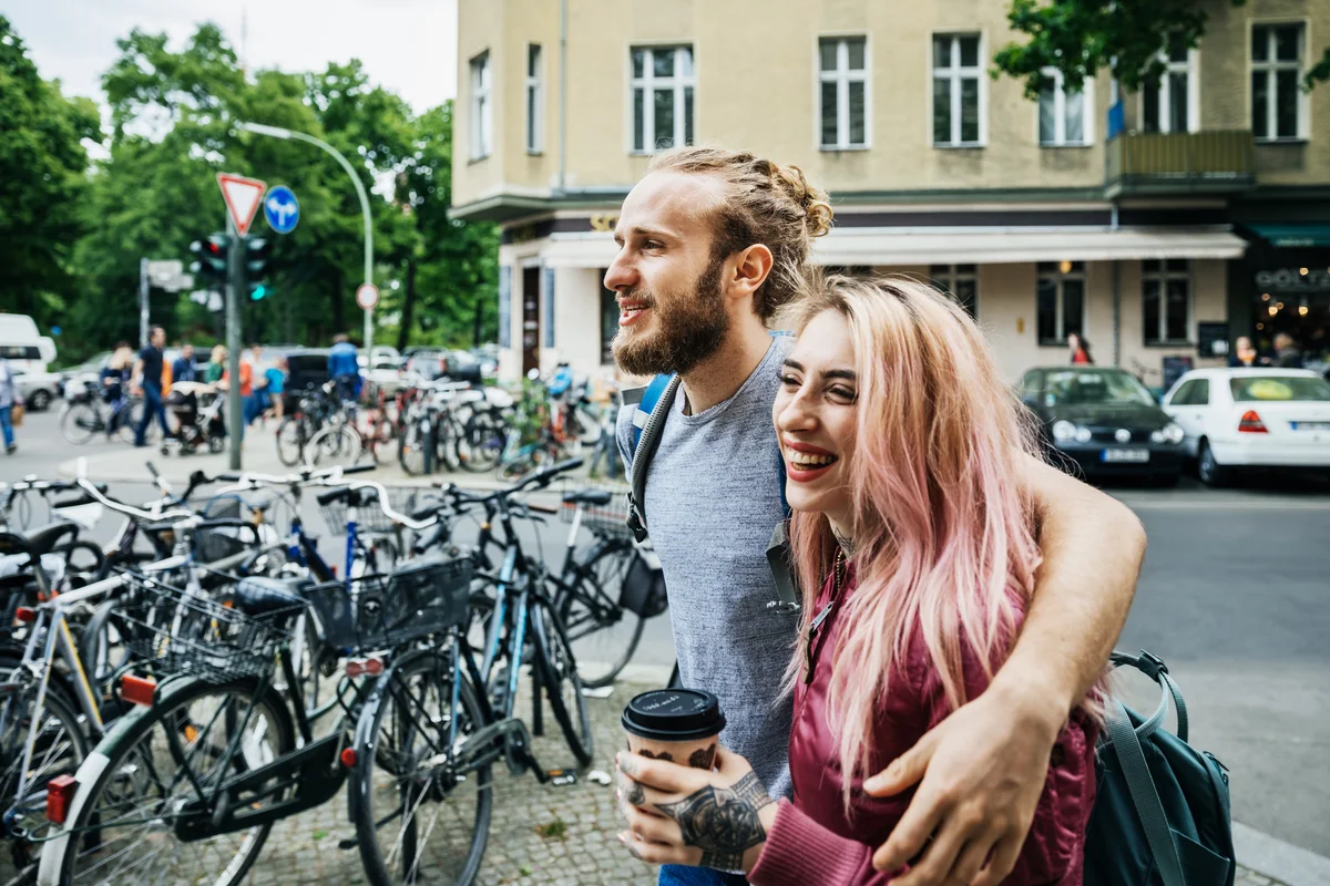 Guy and girl on a walk with coffee