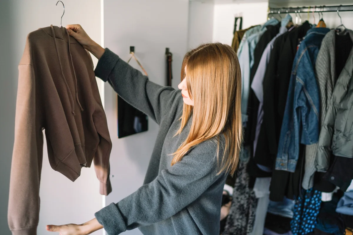 woman hanging up clothes