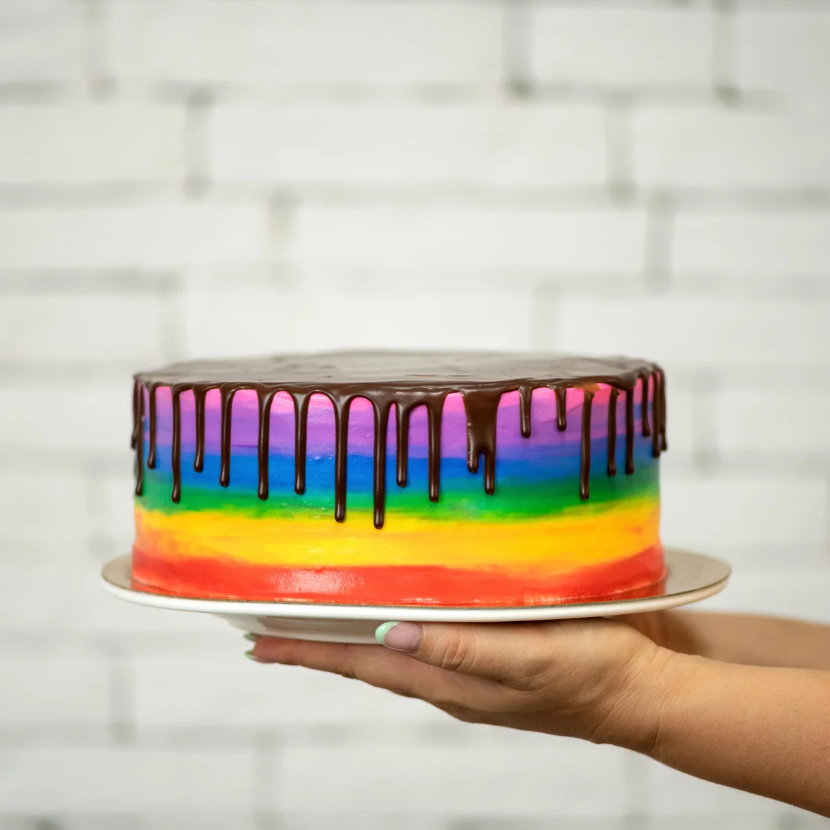 Rainbow cake with chocolate topping