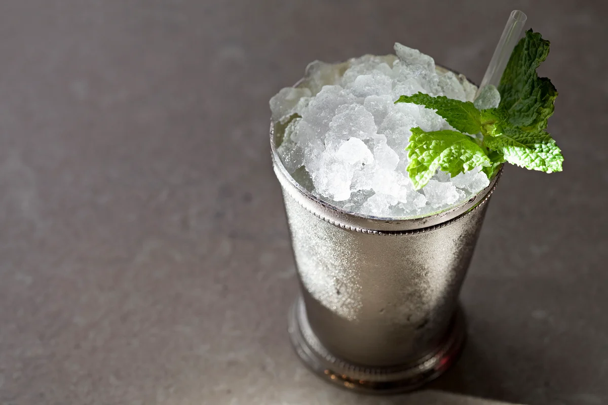 Mint julep mocktail in metal glass garnished with mint