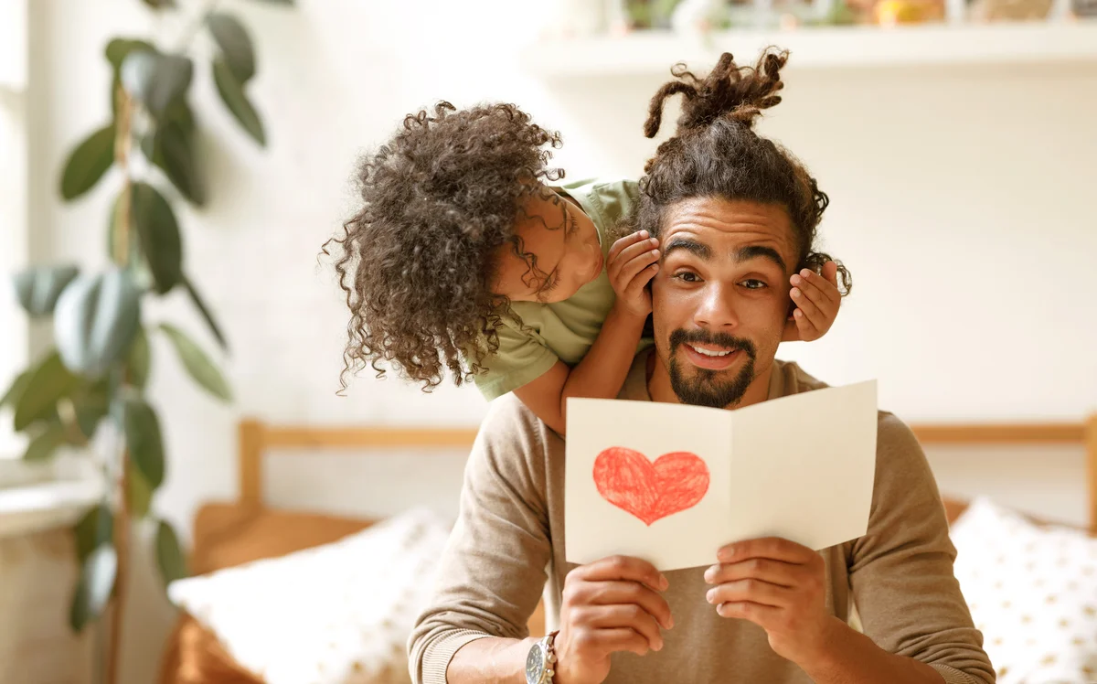 Son congratulating dad for father's day