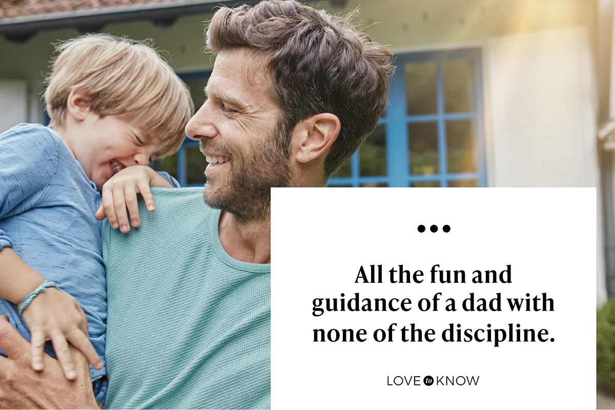 Uncle carrying nephew in front of a house