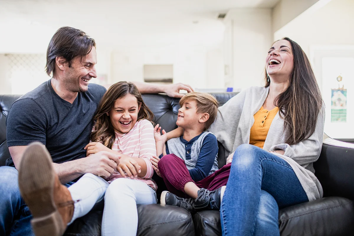 Portrait of family on sofa at home