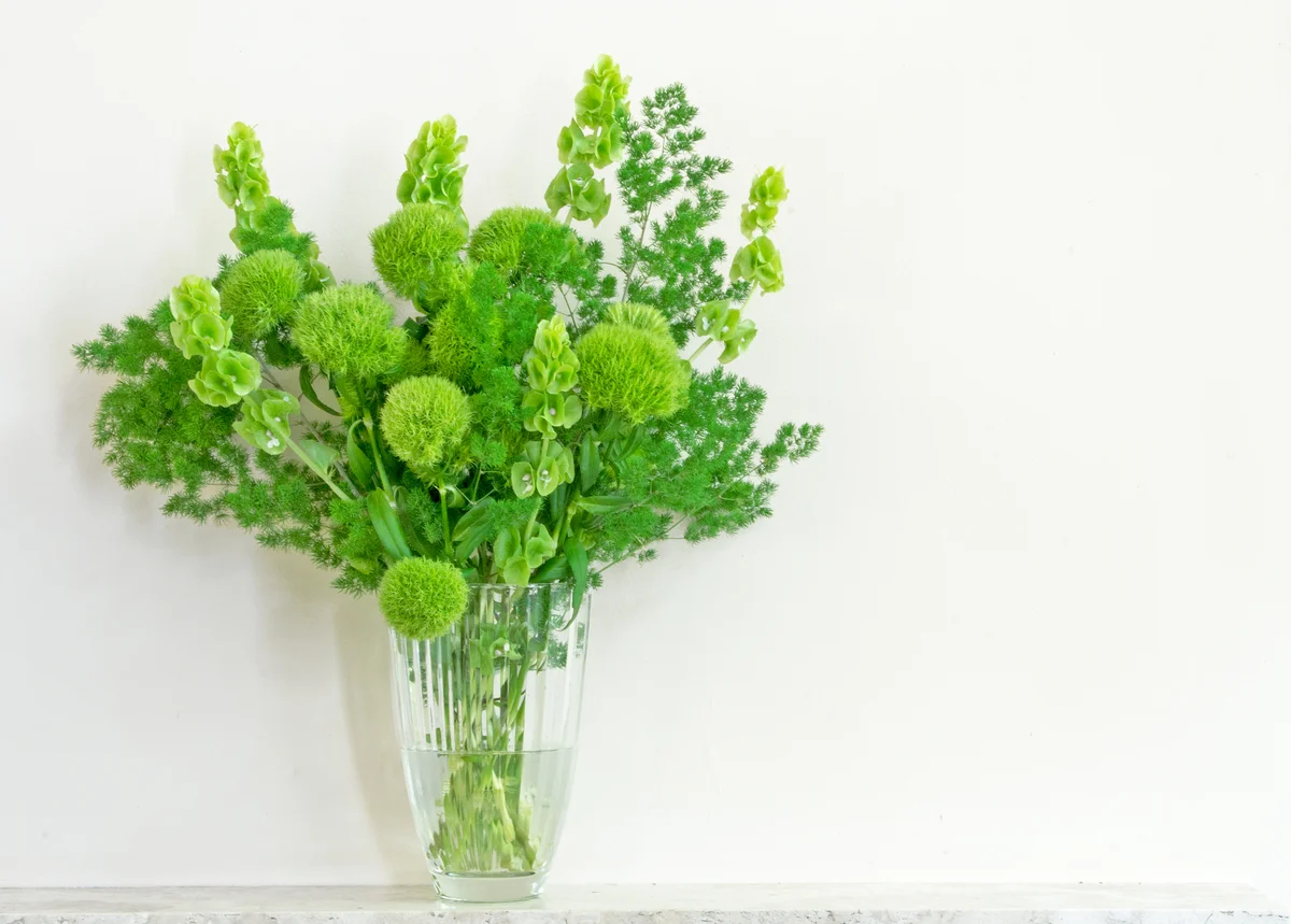 green florals on a mantel