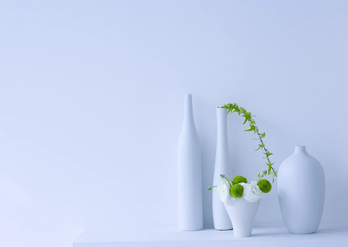 collection of white vases with green florals