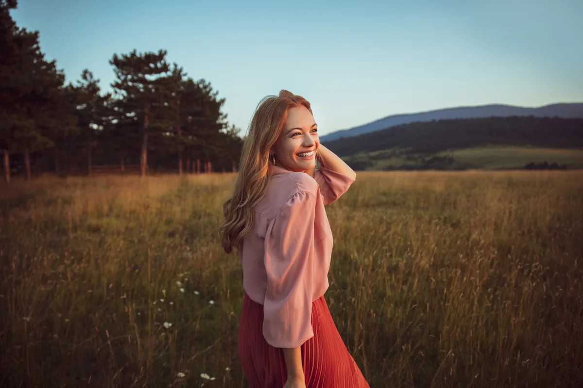 Girl smiling in field