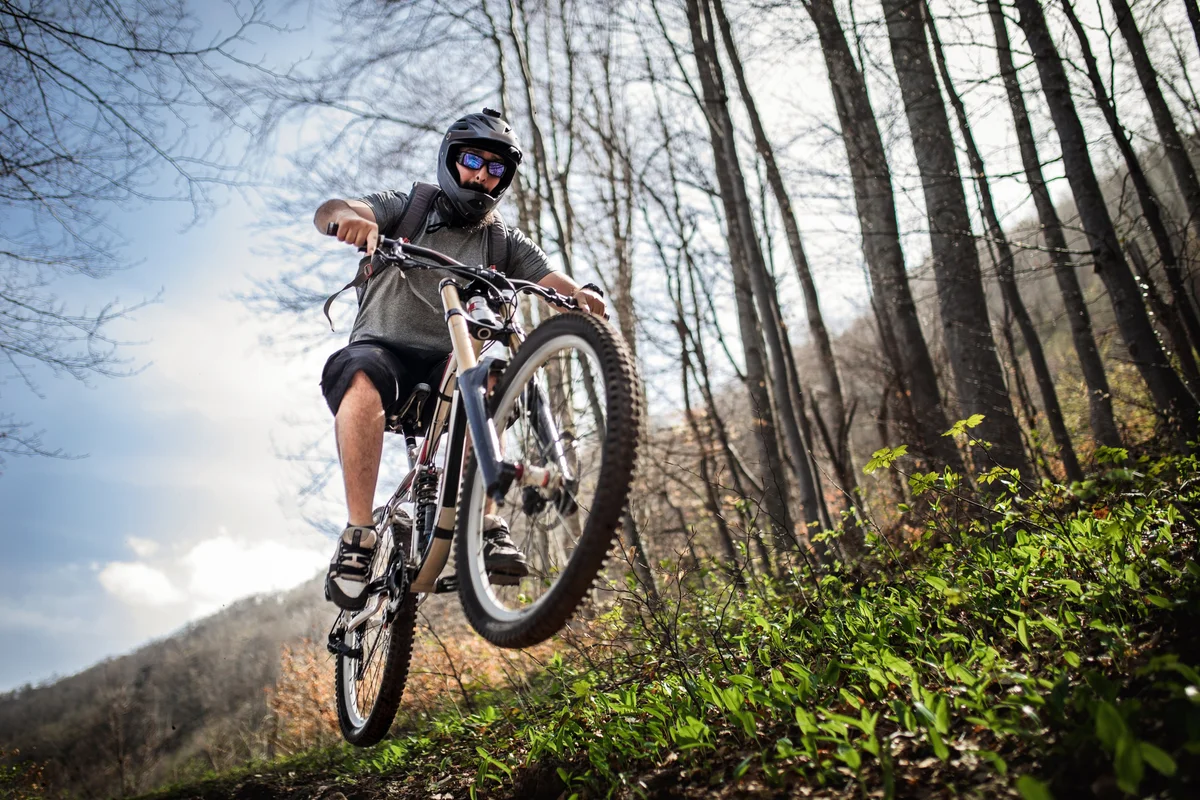Guy biking on trail