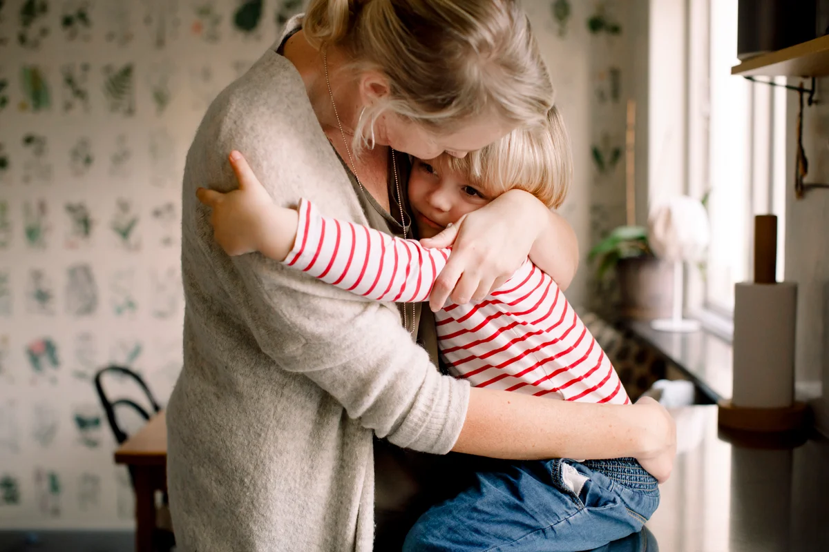 Mother consoling her child