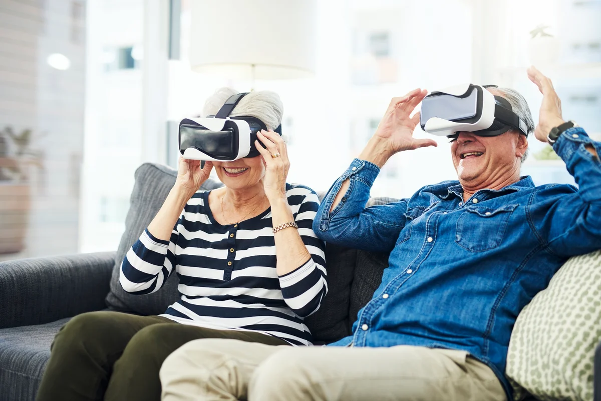 Elderly couple having fun playing VR