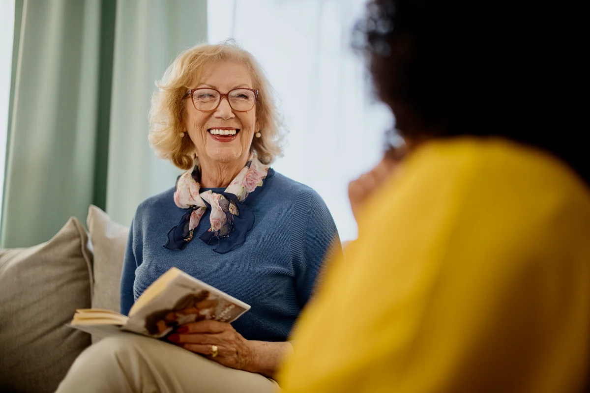 Happy senior mom in book club