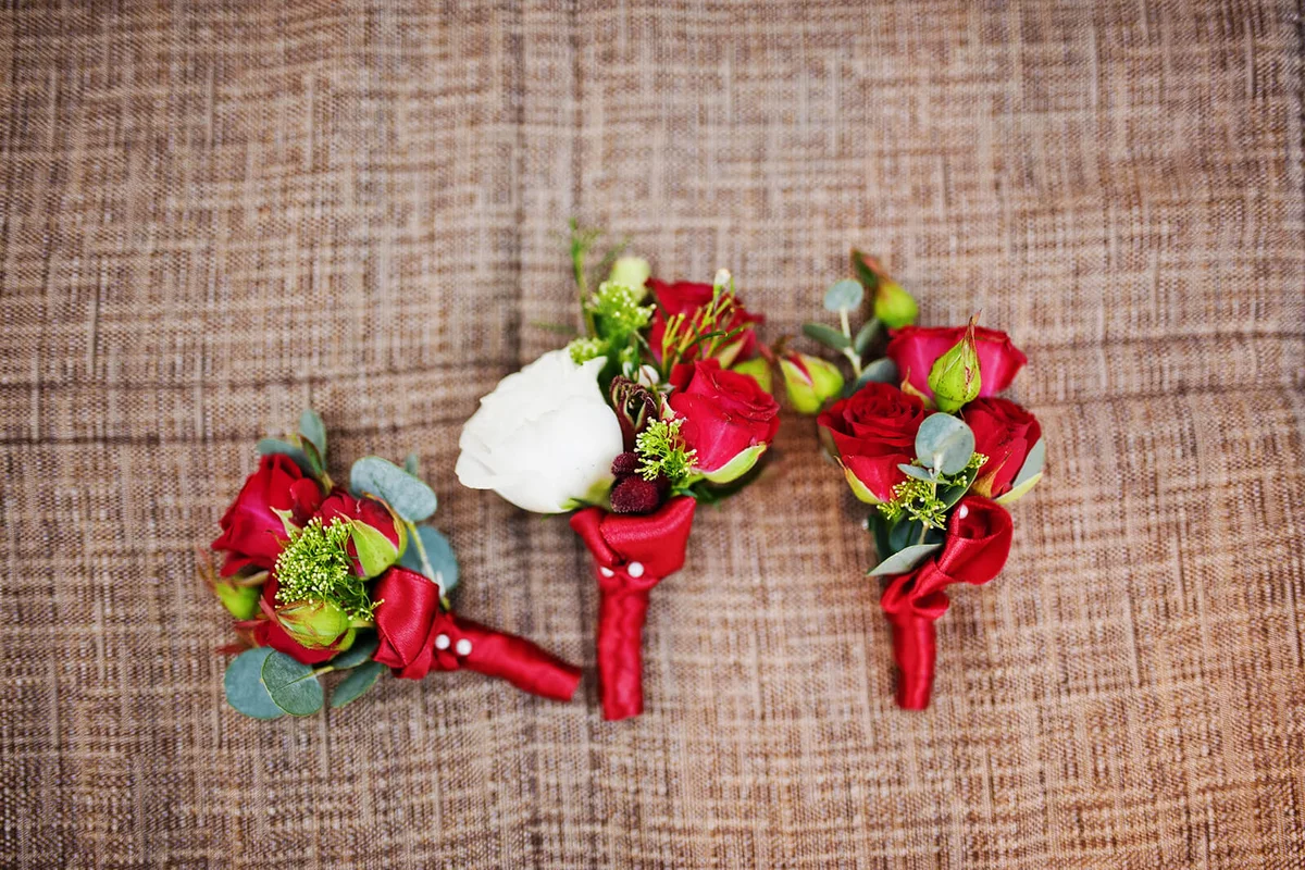Red and white buttonhole flowers