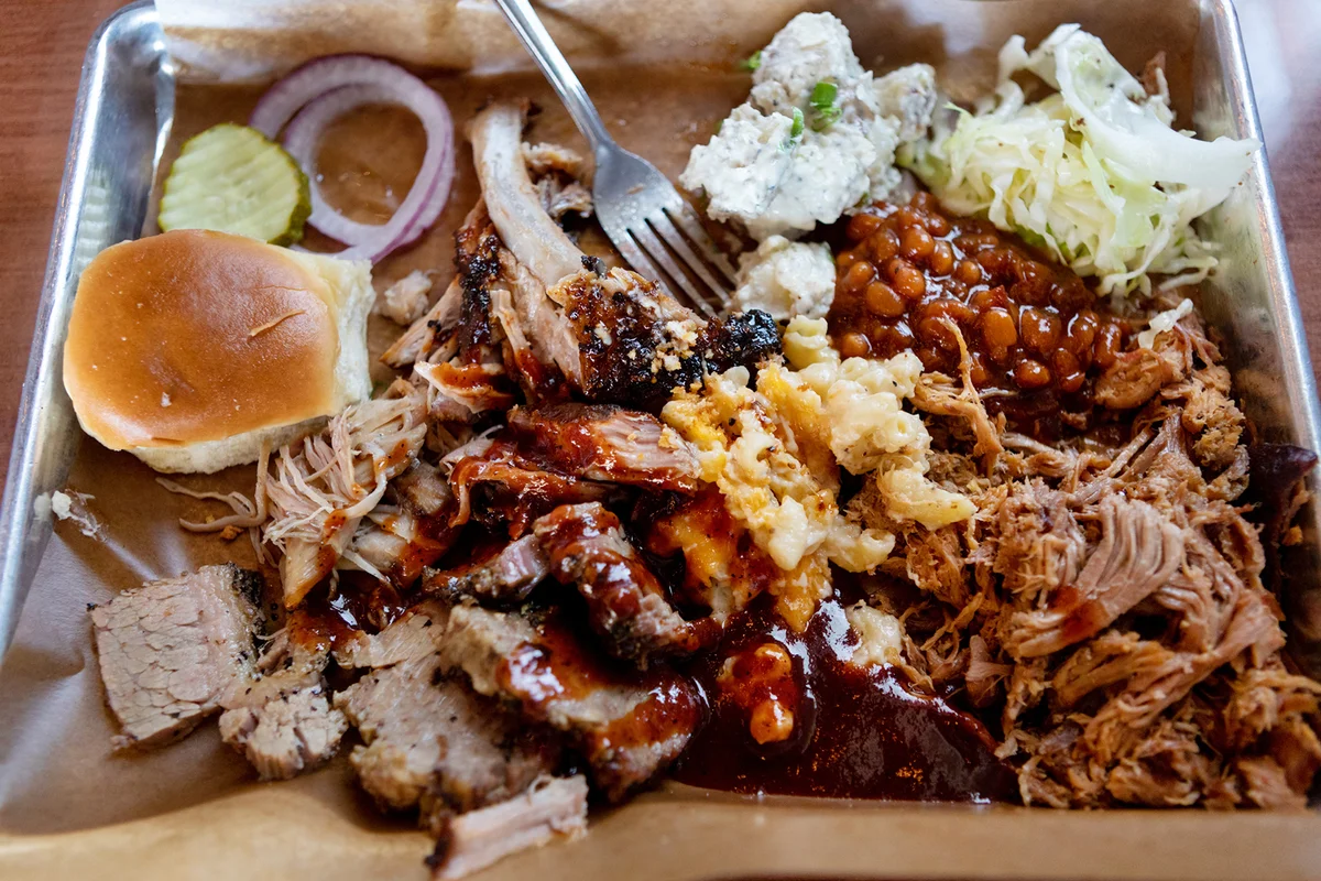 Above view of barbecue and sides on trays