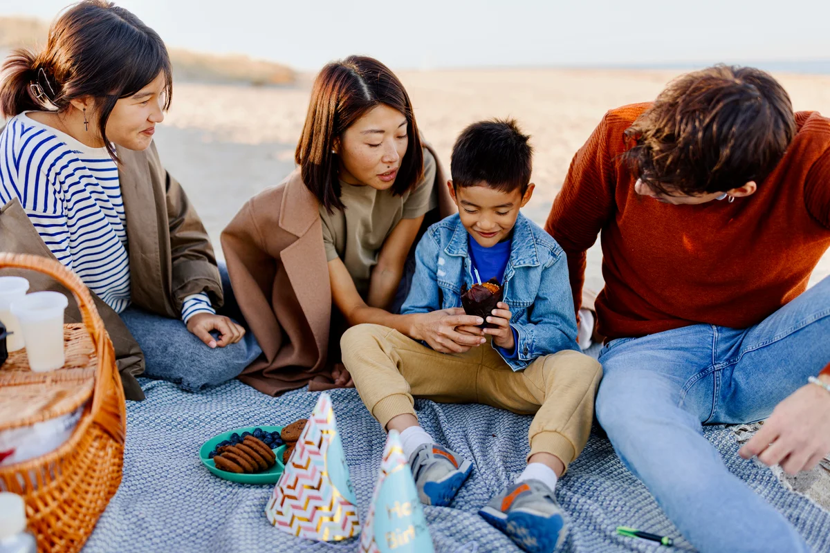 little boy having beach birthday party
