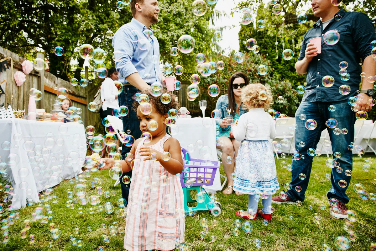 child playing with bubbles