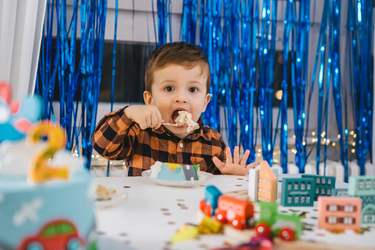 child eating birthday cake
