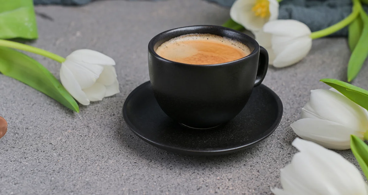 Cup of coffee with flowers