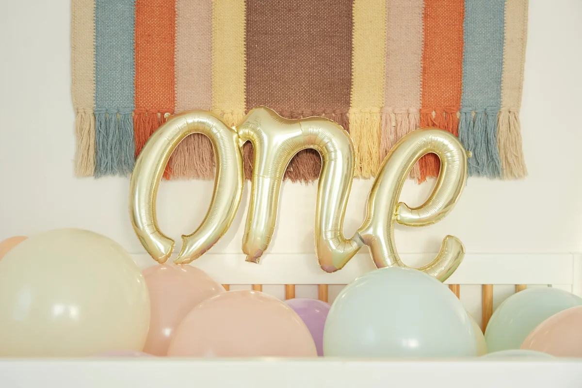 gold balloons that spell out one
