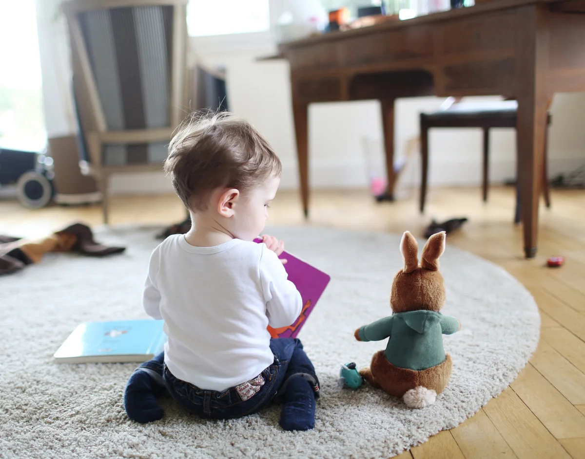 baby reading to a bunny