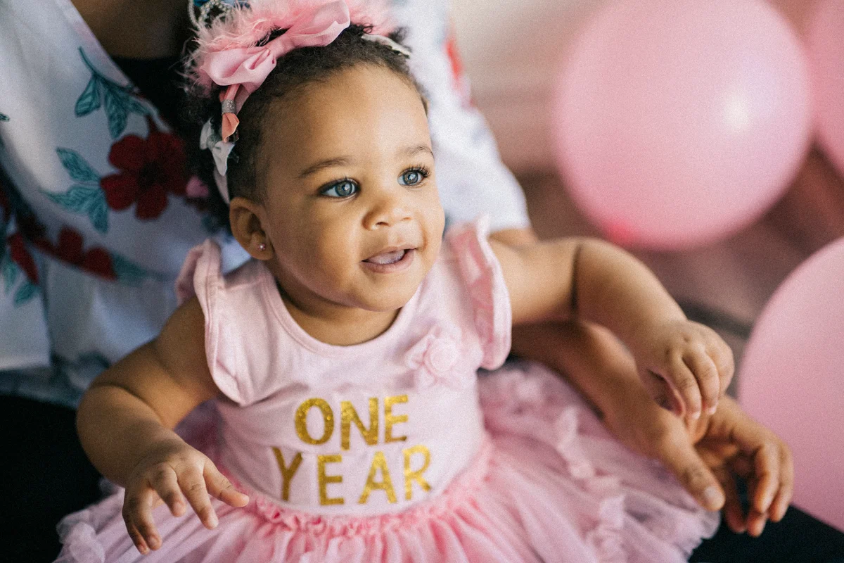 baby in one-year onesie