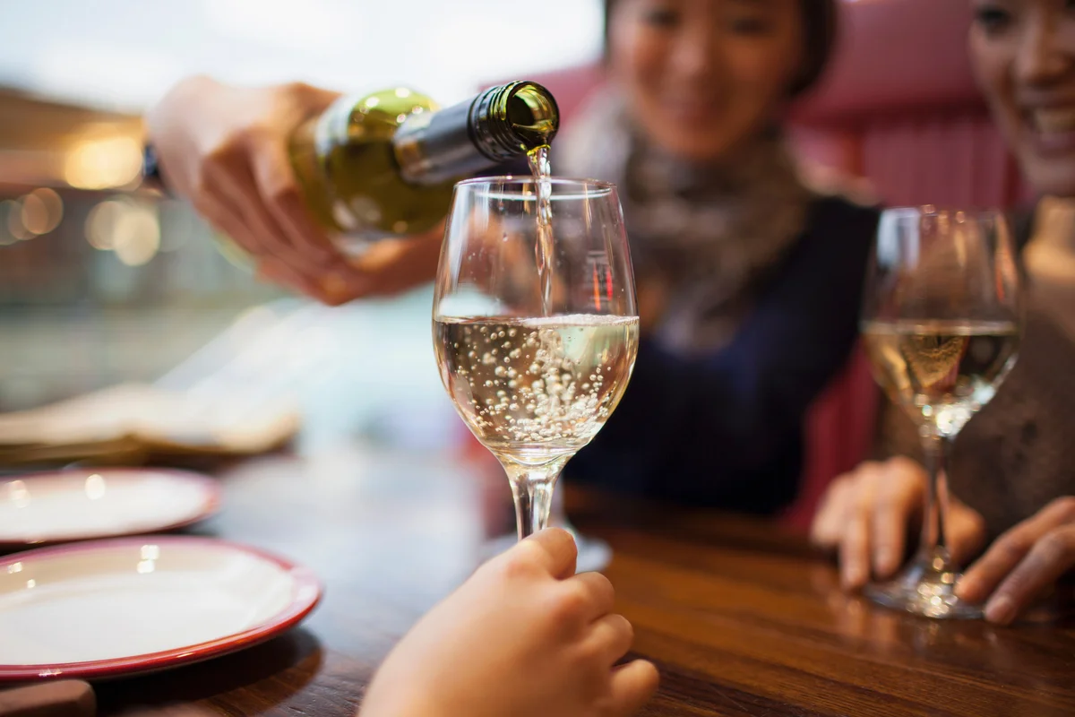 pouring white wine
