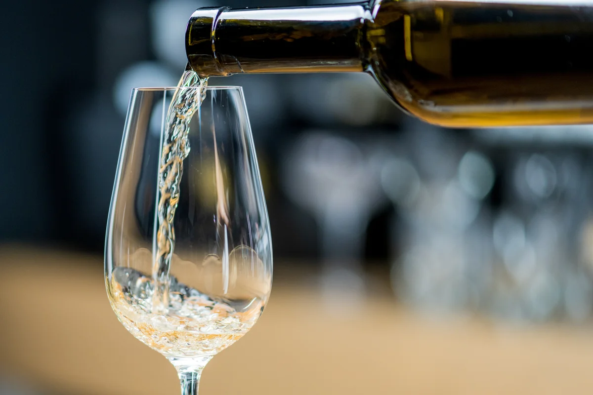 pouring a glass of sauvignon blanc