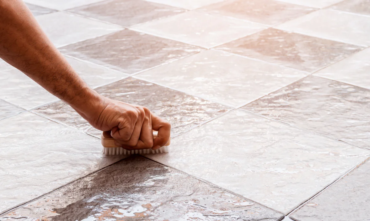 scrubbing a tile floor