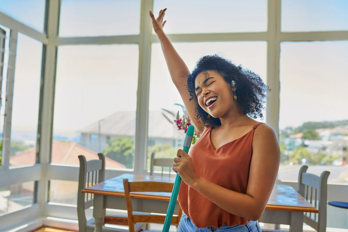 happy woman cleaning