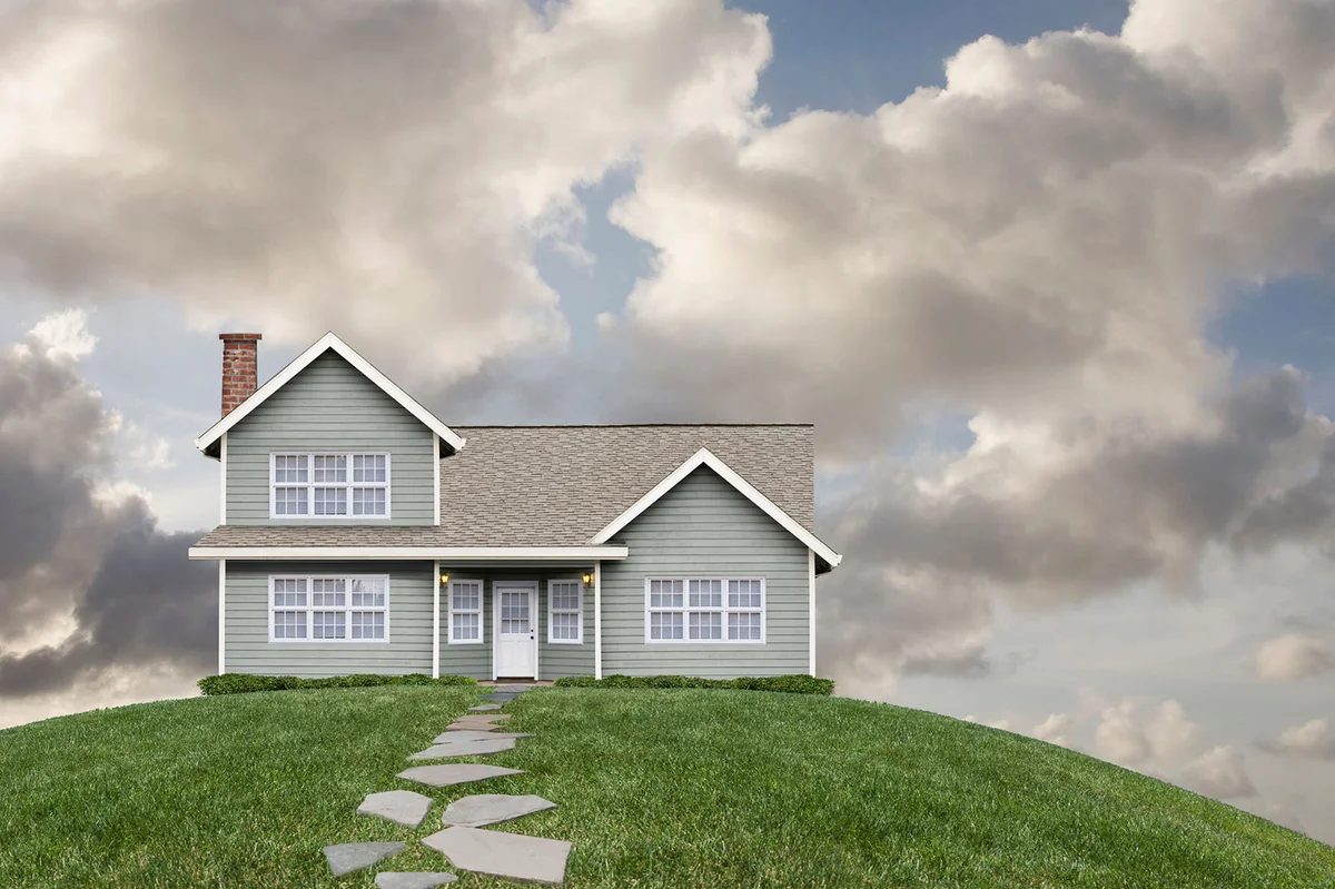 House on grassy hill