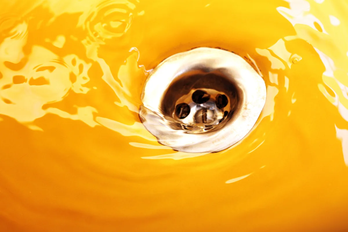 water flowing down sink drain