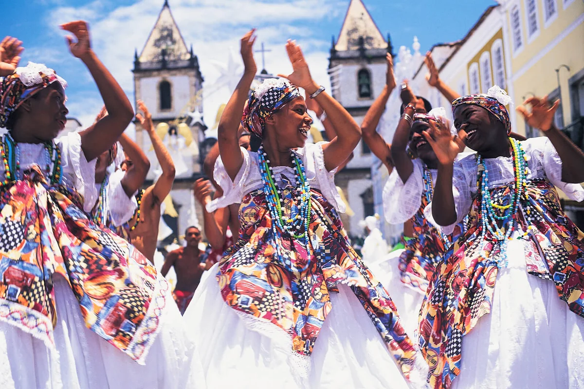 Brazil, Salvador, female dancers in street clapping