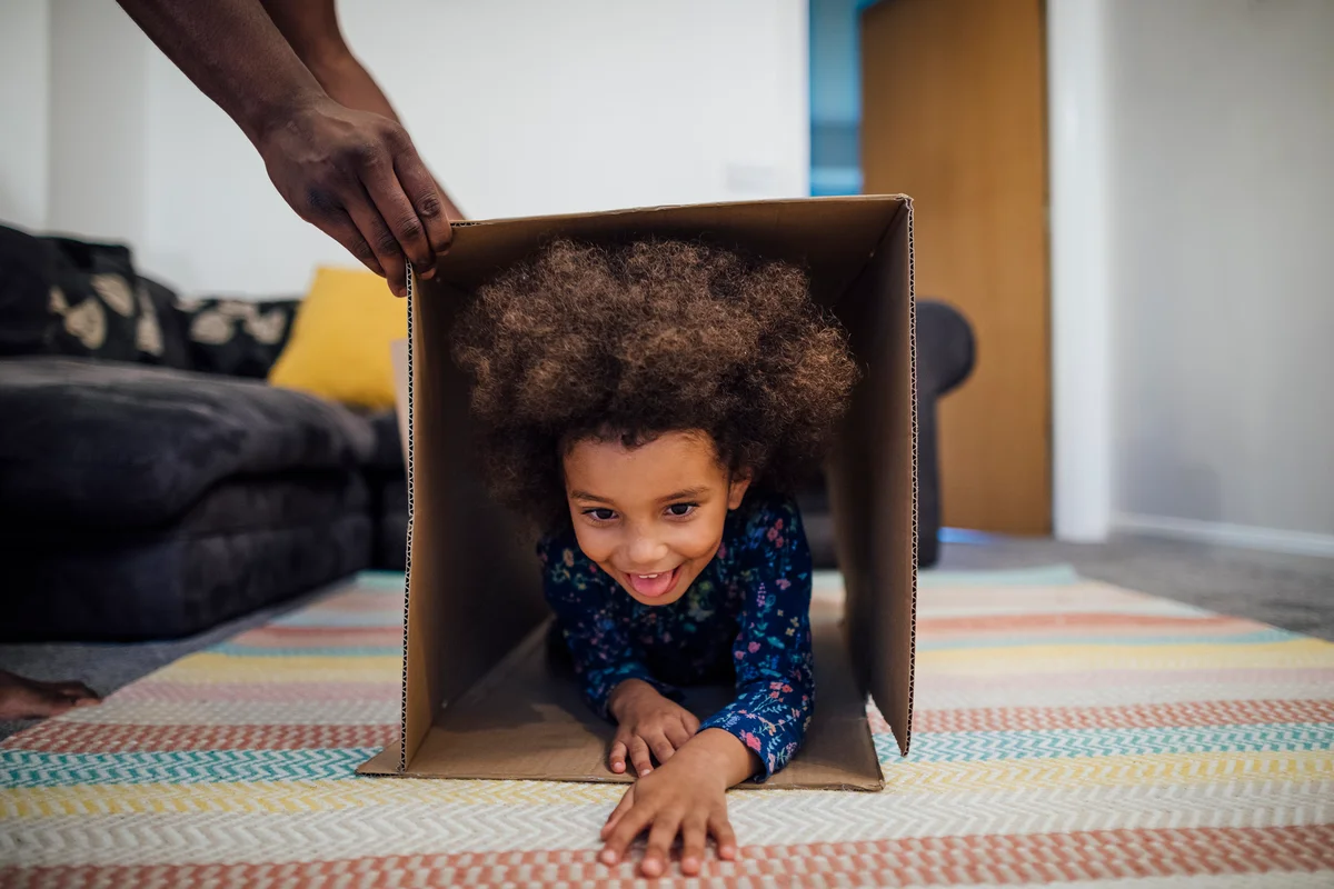 Child playing in obstacle course at home