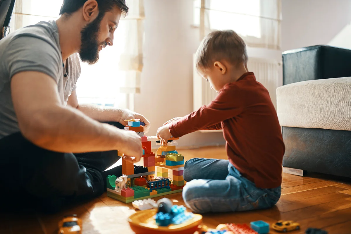 Father & son building with Legos