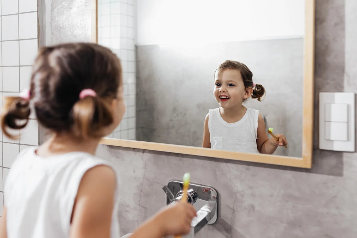 Little Girl Smiling at Herself