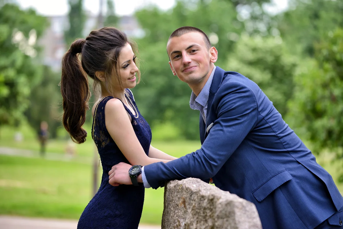 Couple taking prom photos outside