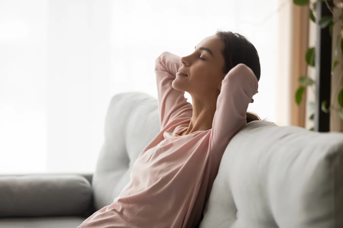 woman relaxing on couch