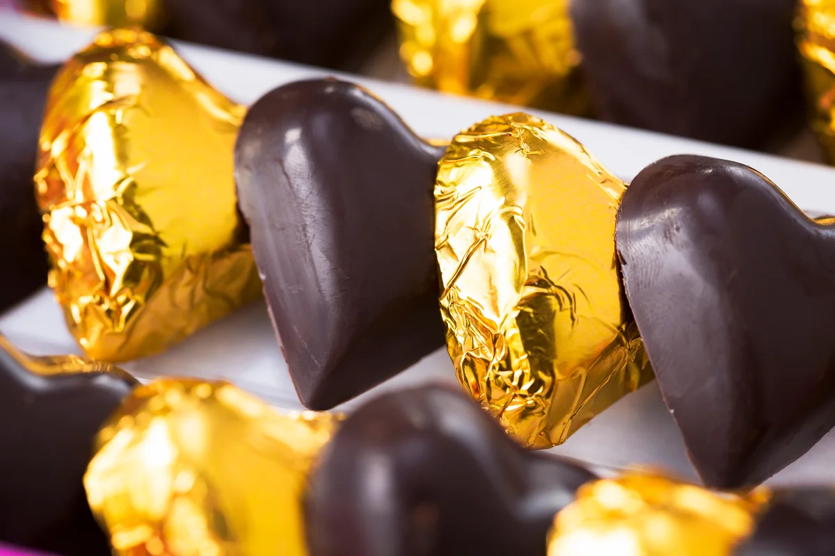 Heart-shaped chocolates wrapped in gold foil