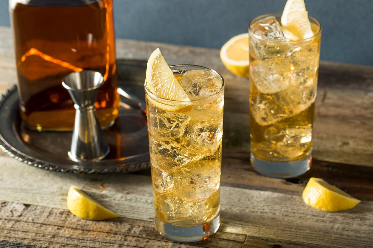 Gold-colored cocktails in highball glasses