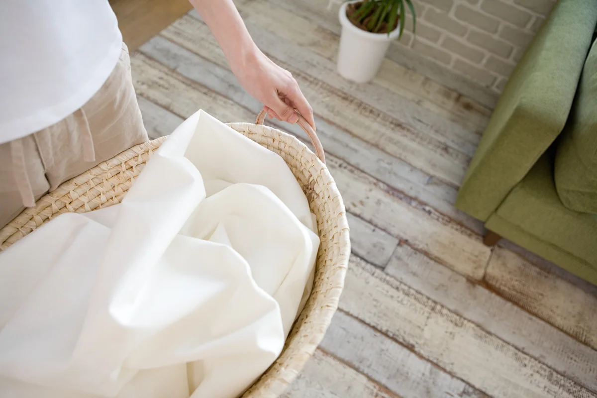 woman carrying laundry basket