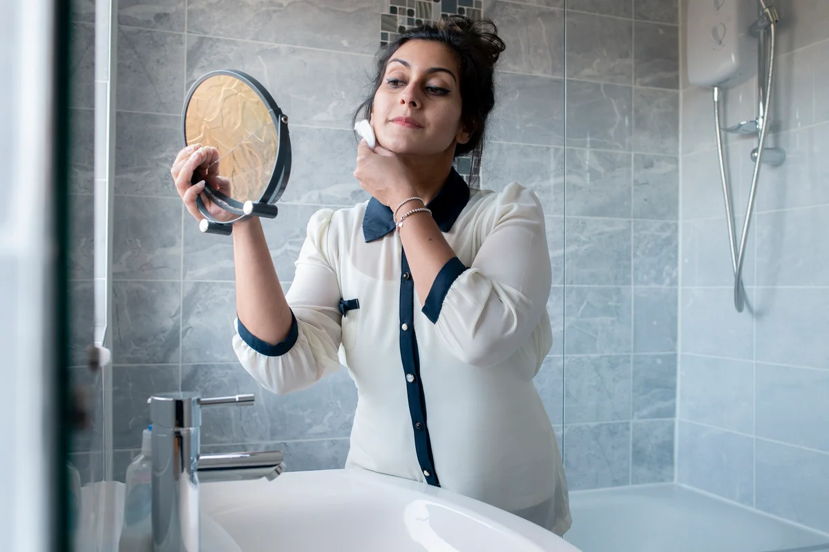 woman removing makeup