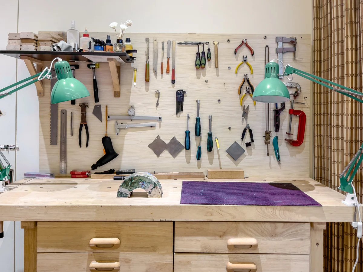 Neatly organized tools hanging on wall