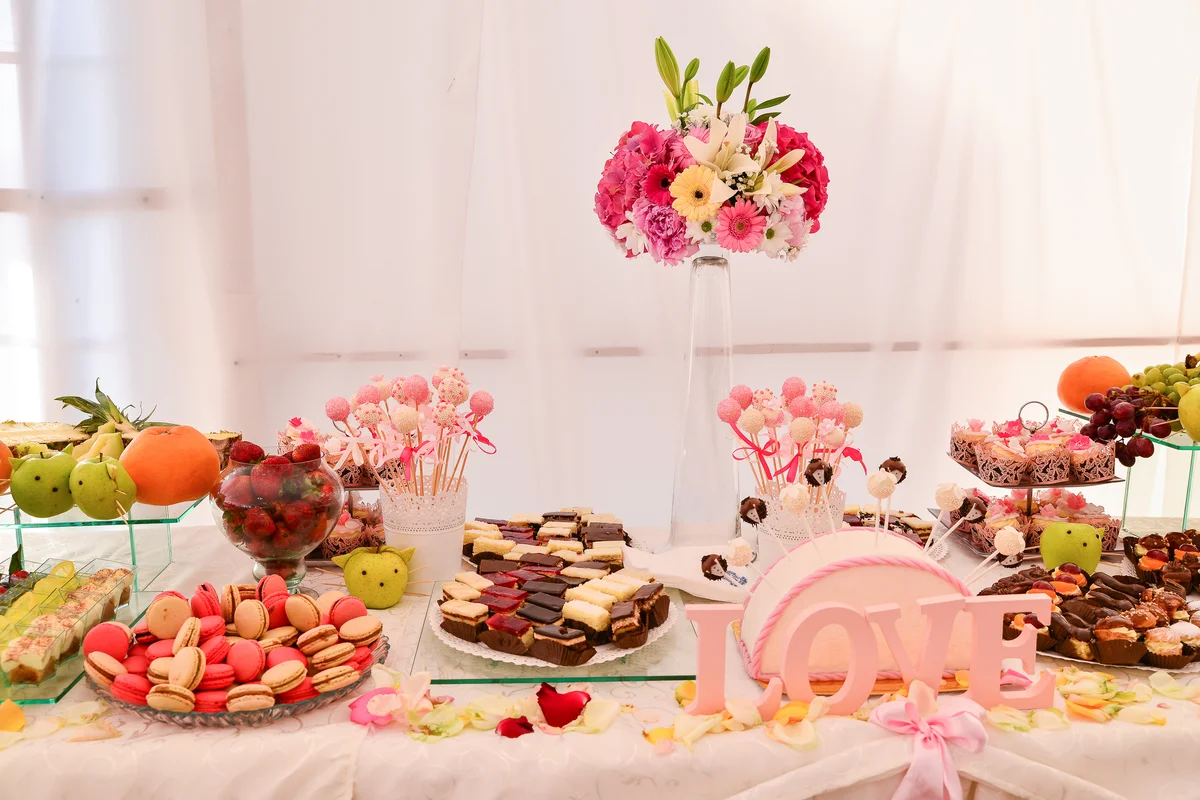 dessert table with floral centerpiece
