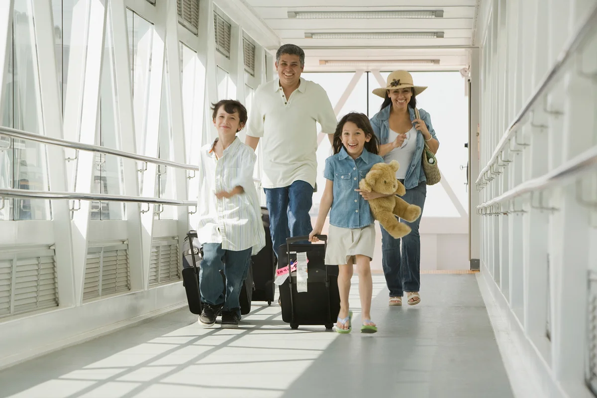 family walking through airport