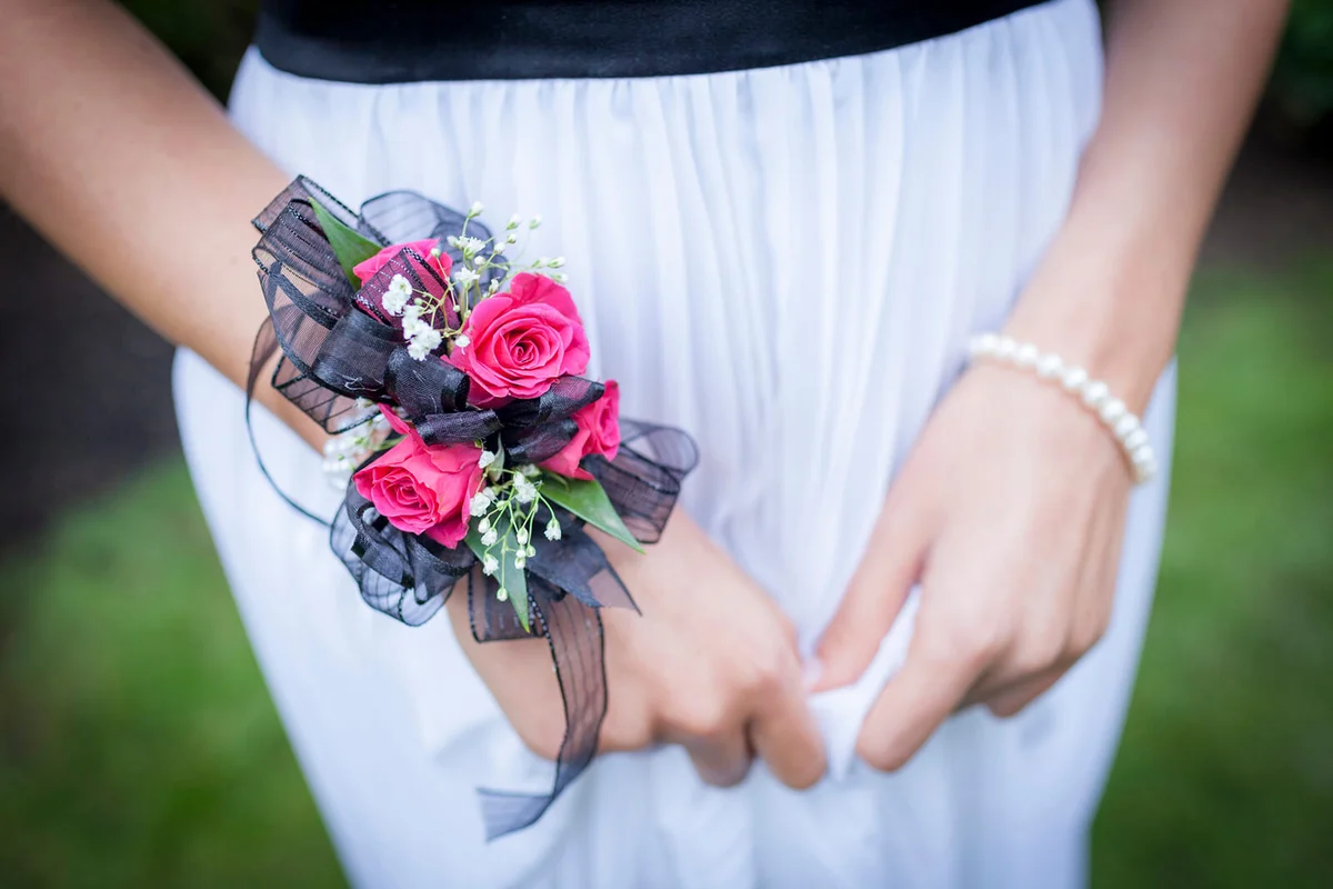 teenage girl in prom attire wearing corsage