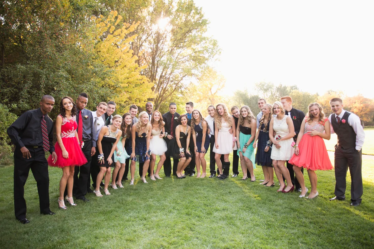 Large group of teens taking group photo for prom