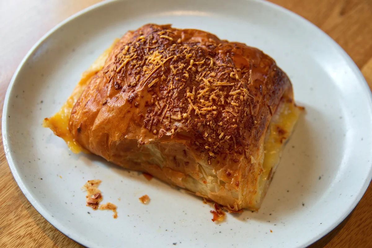 Ham and cheese croissant on a plate